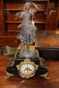 Ornate spelter and gilt metal mantel clock of a young girl and a lamb, with enamel dial, 53cm high.