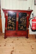 Oriental lacquered cabinet having two lacquered panel doors above two drawers, 93cm by 81.