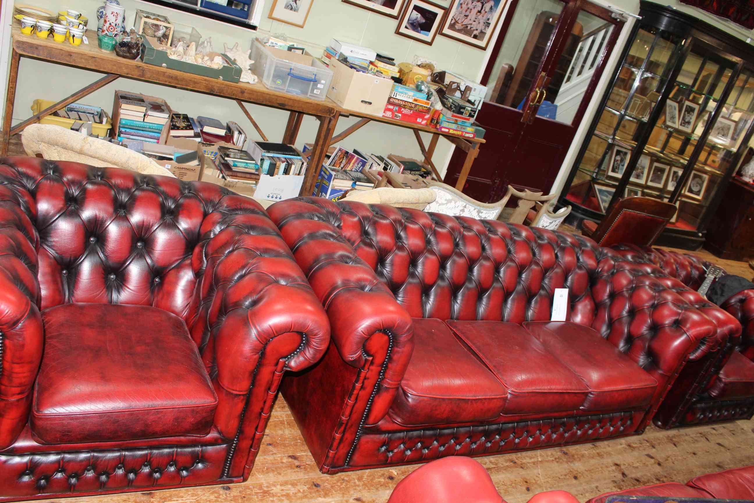 Three piece ox blood deep buttoned leather three piece Chesterfield suite.