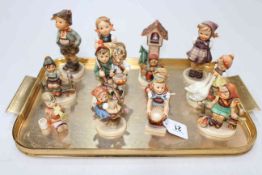 Collection of twelve Hummel children figures.