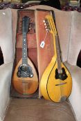 Two mandolins with one case, one by Il Globo.