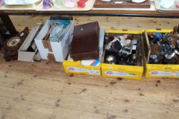 Boxes of collectables including celluloid dolls, clocks, cameras, binoculars, LP records, etc.