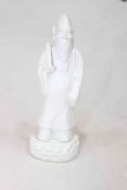 Antique Chinese blanc de chine figure of an Immortal, 23cm high.