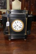 Edwardian ebonised and slate and brass column mantel clock with enamel dial.