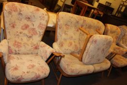 Ercol button backed three piece lounge suite and footstool.