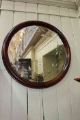 Circular framed bevelled etched wall mirror, 71cm diameter.