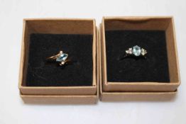 Two aquamarine and diamond 9 carat gold rings, size O and K.