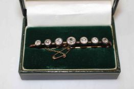 Good seven stone diamond bar brooch, the graduated stones, from centre 0.