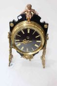 Ornate French gilt metal mantel clock with cherub surmount, 35cm.