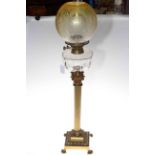 Brass columned oil lamp with glass reservoir and etched glass shade, 86cm high.