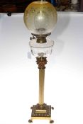 Brass columned oil lamp with glass reservoir and etched glass shade, 86cm high.