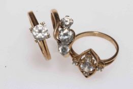 Three 9 carat gold gem set rings.