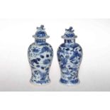 Two small Chinese blue and white baluster vases and covers,