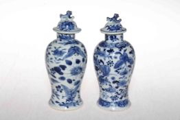 Two small Chinese blue and white baluster vases and covers,