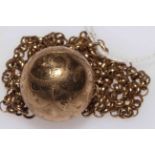 9 carat gold chain necklace with sphere locket.