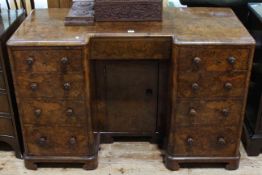 Figured walnut inverted breakfront nine drawer pedestal desk with kneehole cupboard door,