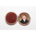 Oval portrait miniature in carrying case, 7cm by 5cm, together with small gilt framed portrait (2).