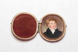 Oval portrait miniature in carrying case, 7cm by 5cm, together with small gilt framed portrait (2).