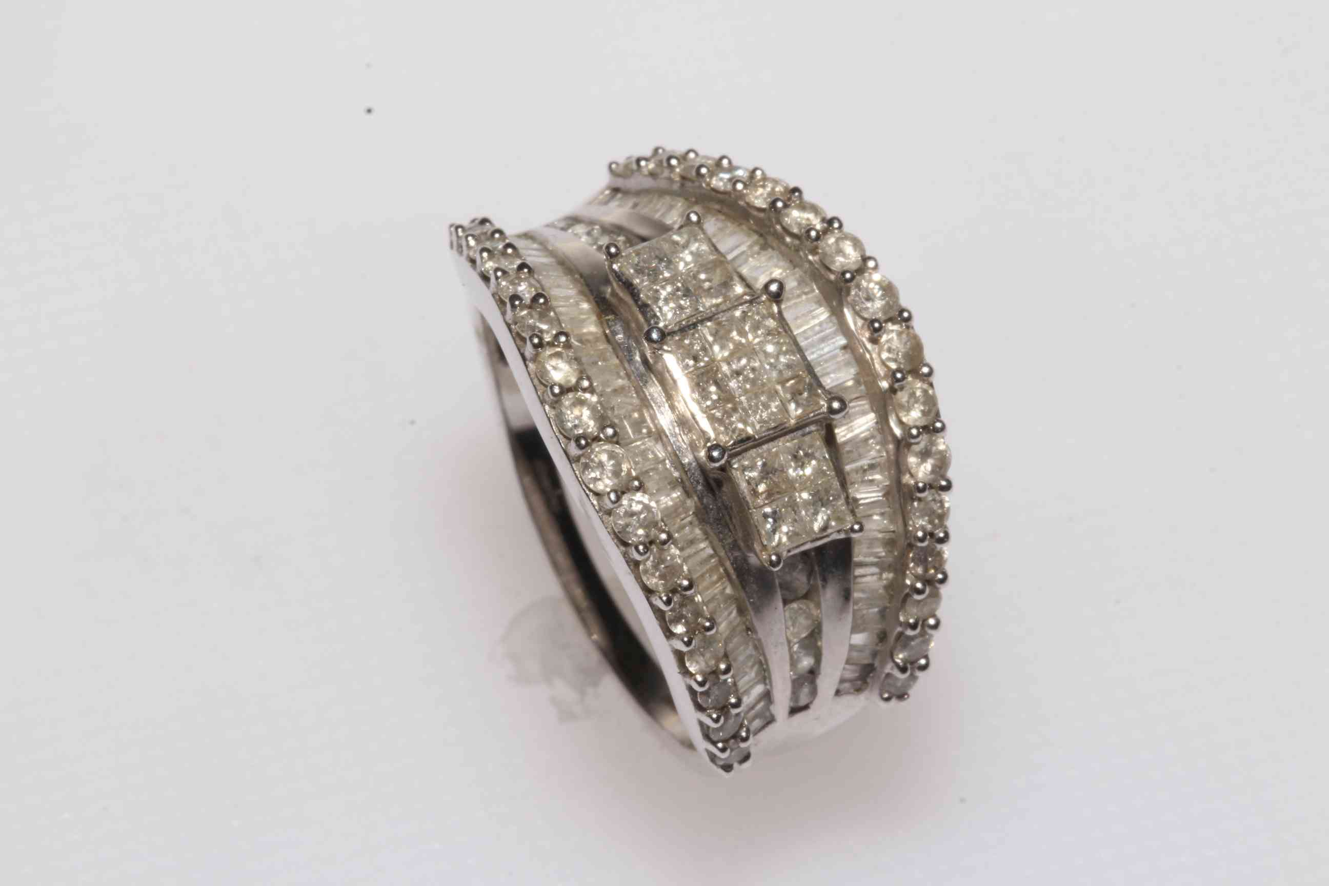 Fancy diamond multi stone 9 carat white gold ring, size S.