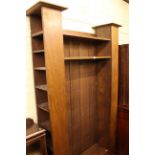 Early 20th Century oak bookcase, the open centre flanked by two opposing open ends,