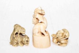 Two Japanese/Chinese ivory animal netsuke, signed, and ivory chopseal kylin (3).