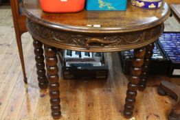 Carved oak single drawer demi-lune console table on bobbin legs, 76.5cm x 95cm x 48cm.