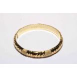 14 carat two tone yellow gold bangle.