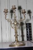 Ornate three branch brass candelabrum, 41cm high.