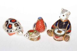 Four Royal Crown Derby paperweights, teddy bear, robin, tortoise and strawberry hedgehog.