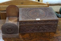 Ornate carved box and decorative carved bookends.