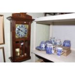 Two Honiton pottery jugs, Ringtons caddies, jugs, plates, oak wall clock, etc.