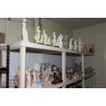 Large collection of figurines, lidded vases, glass wares, part tea sets, mantel clock,