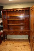 Good quality burr walnut period style shelf and cupboard back four drawer dresser on ball and claw