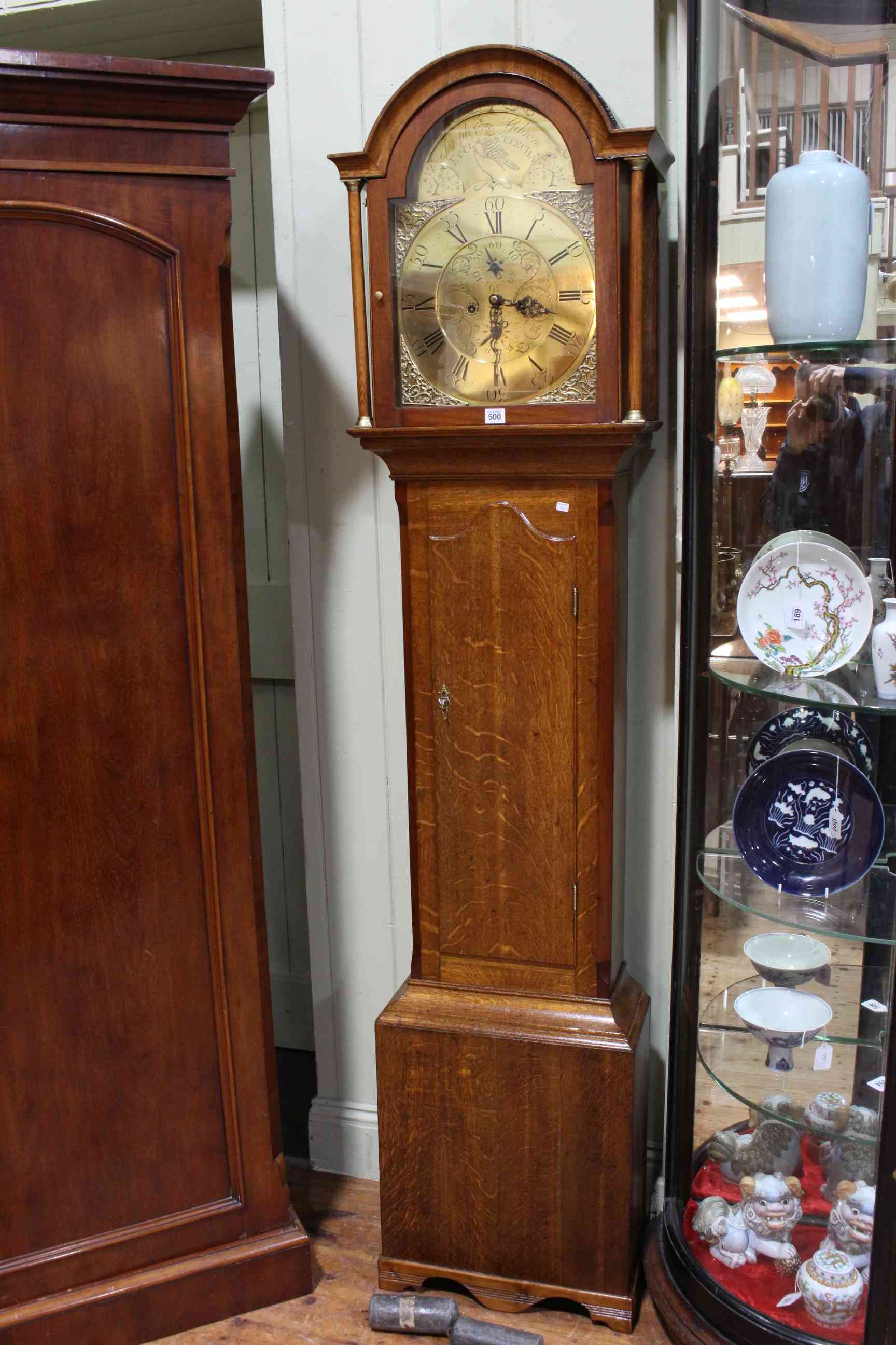 Antique oak 8-day longcase clock having arched brass dial, signed Joseph Gibson, Ecclefechan.