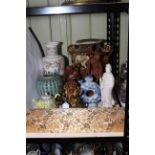 Collection of Oriental porcelain including two handled vase, jar, teapots, carved wood statues,