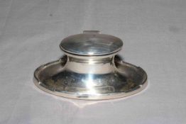 Silver oval desk inkwell, 12cm across, Birmingham circa 1920.