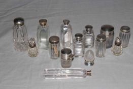 Collection of fourteen silver topped toilet bottles.