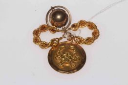 18 carat gold Zodiac sign pendant, 9 carat gold earrings, and globe charm.