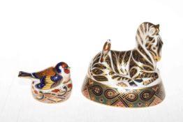 Two Royal Crown Derby paperweights, zebra and goldfinch nesting.