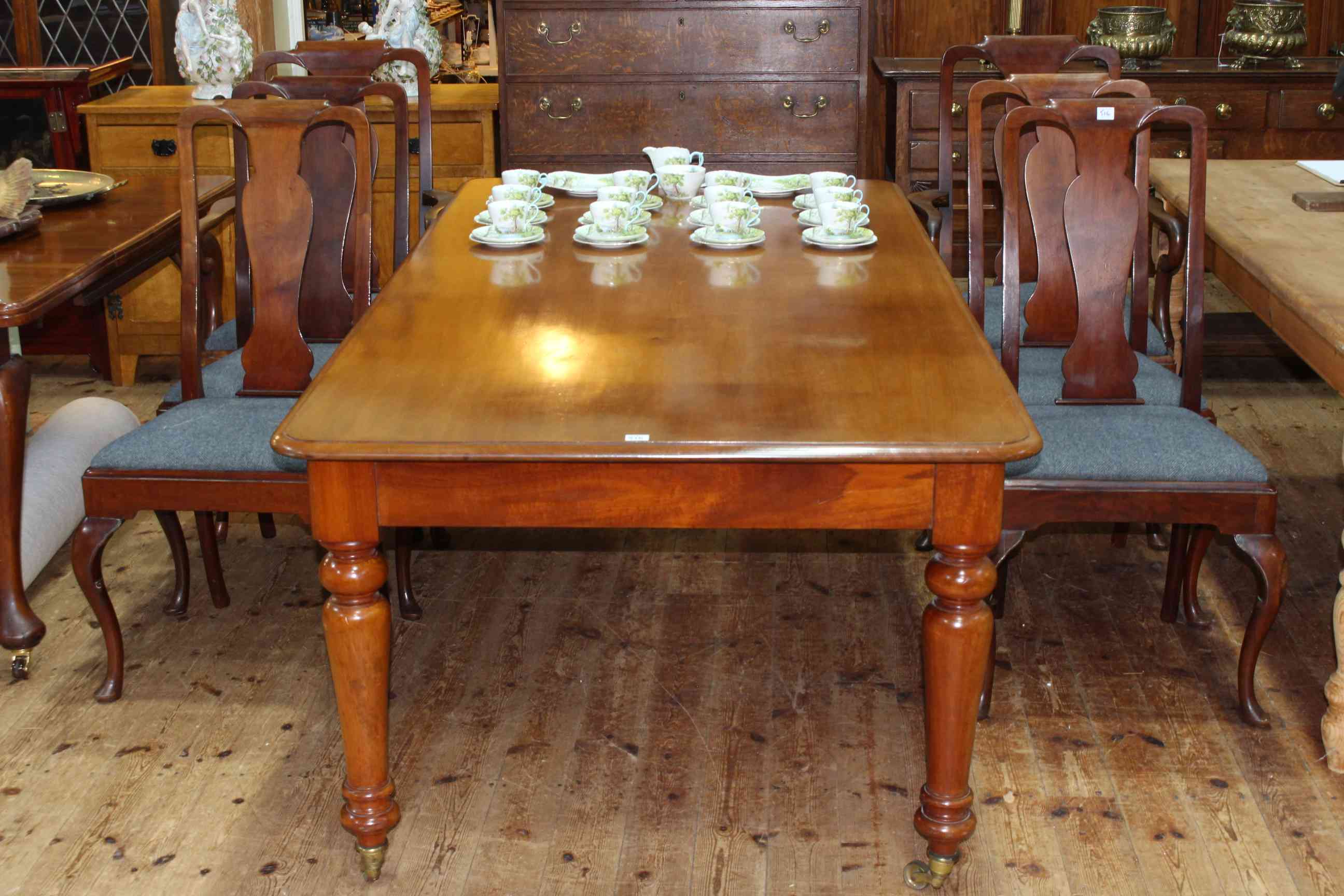 Late 19th Century rectangular mahogany dining table on turned legs 75cm x 106cm x 212cm,