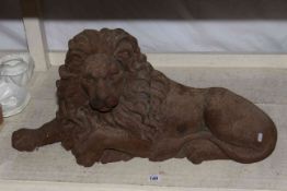 Cast metal model of a recumbent lion, 70cm.