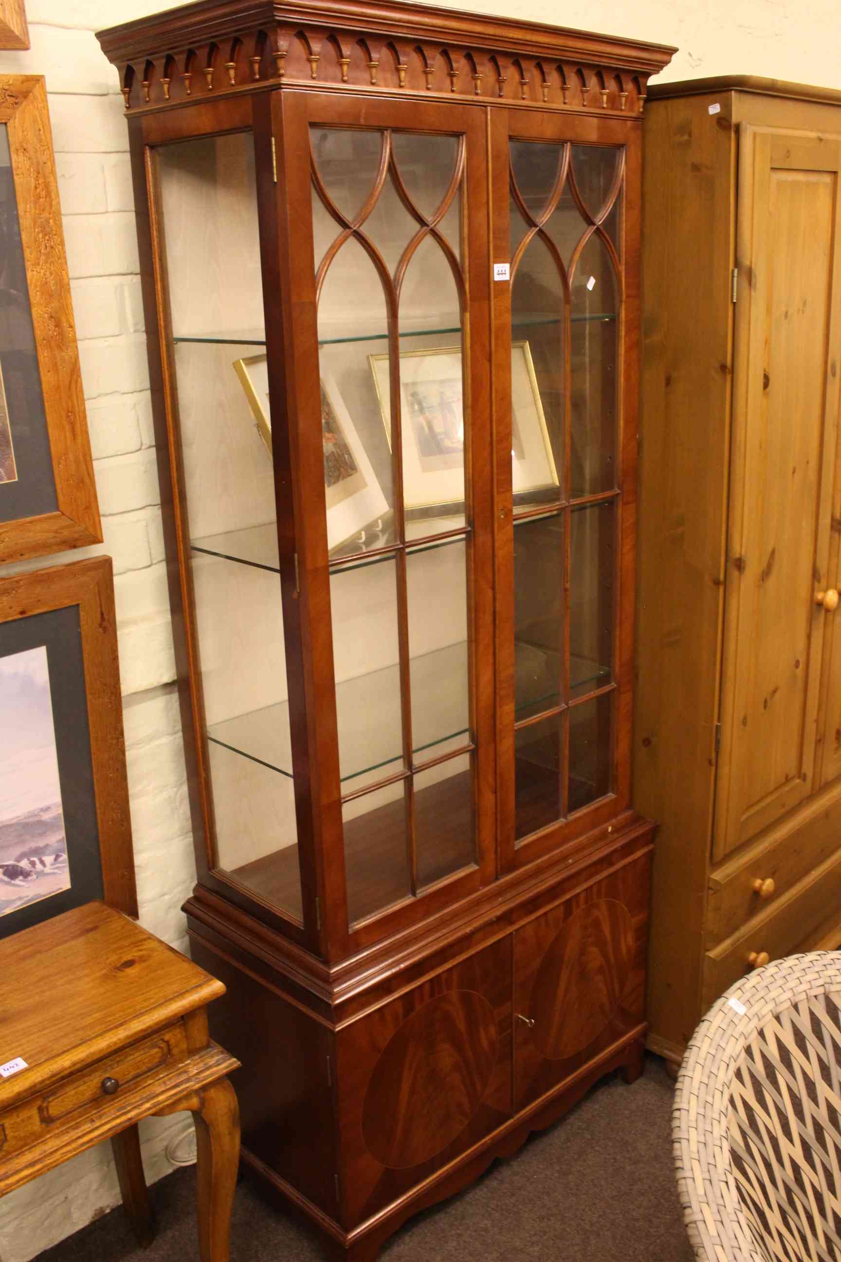 Mahogany display cabinet having two glazed doors above two cupboard doors, 189cm x 78.5cm x 39cm.