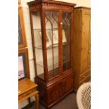 Mahogany display cabinet having two glazed doors above two cupboard doors, 189cm x 78.5cm x 39cm.