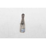 Novelty white metal pencil in the form of champagne bottle, 4.75cm.