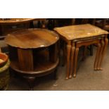 Mahogany circular shaped revolving book table on ball and claw legs,