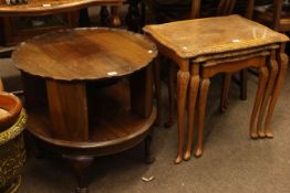 Mahogany circular shaped revolving book table on ball and claw legs,