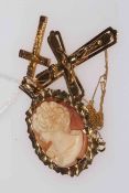 Two 9 carat gold crucifix, one with chain and 9 carat gold mounted cameo pendant (3).