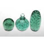 Three Victorian green glass dumps, one with stopper.