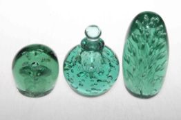 Three Victorian green glass dumps, one with stopper.