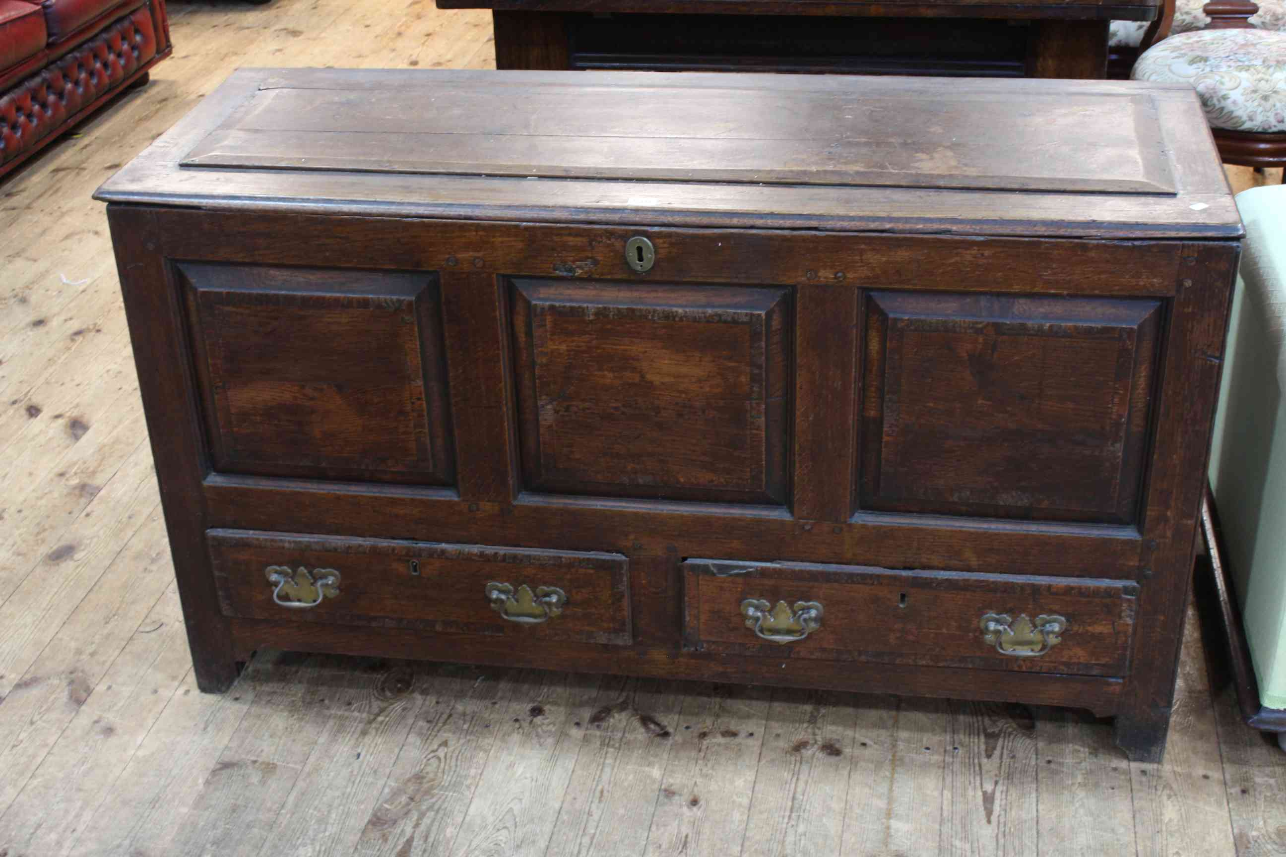 Antique oak triple front coffer with two base drawers, 74cm x 130cm x 49cm.